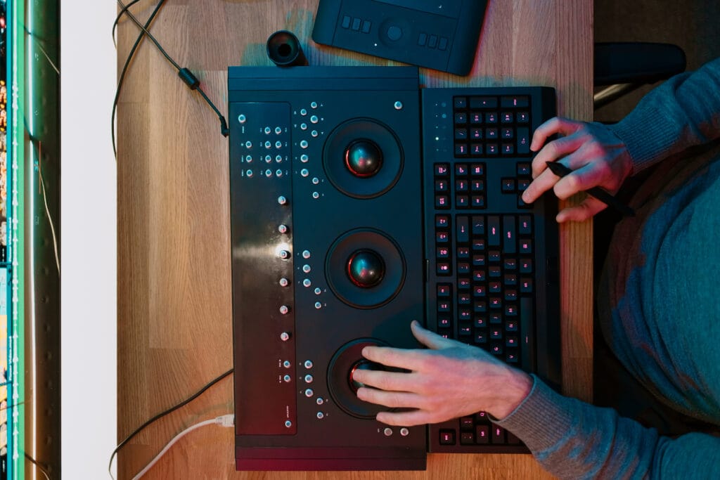 Male hands Video Editor Working on His Personal Computer control panel